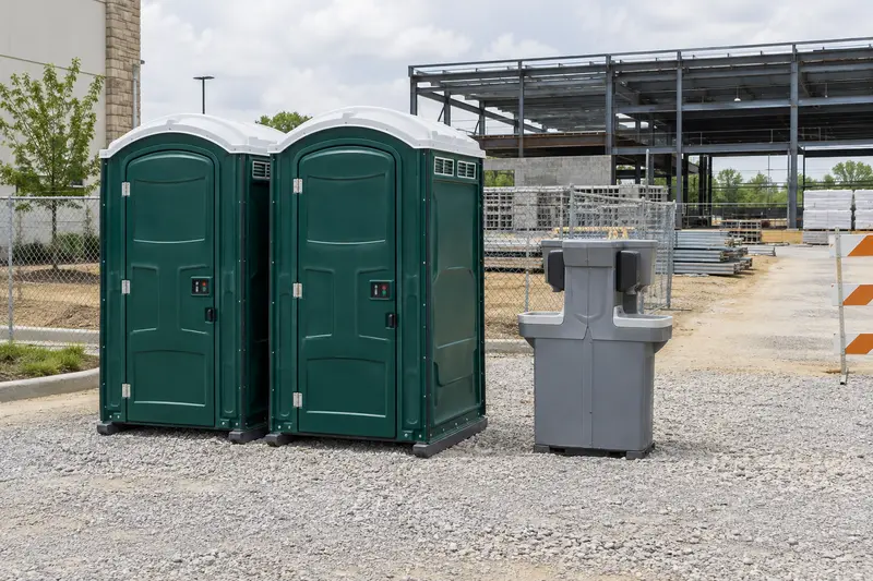 Portable sanitation facilities beside a construction project